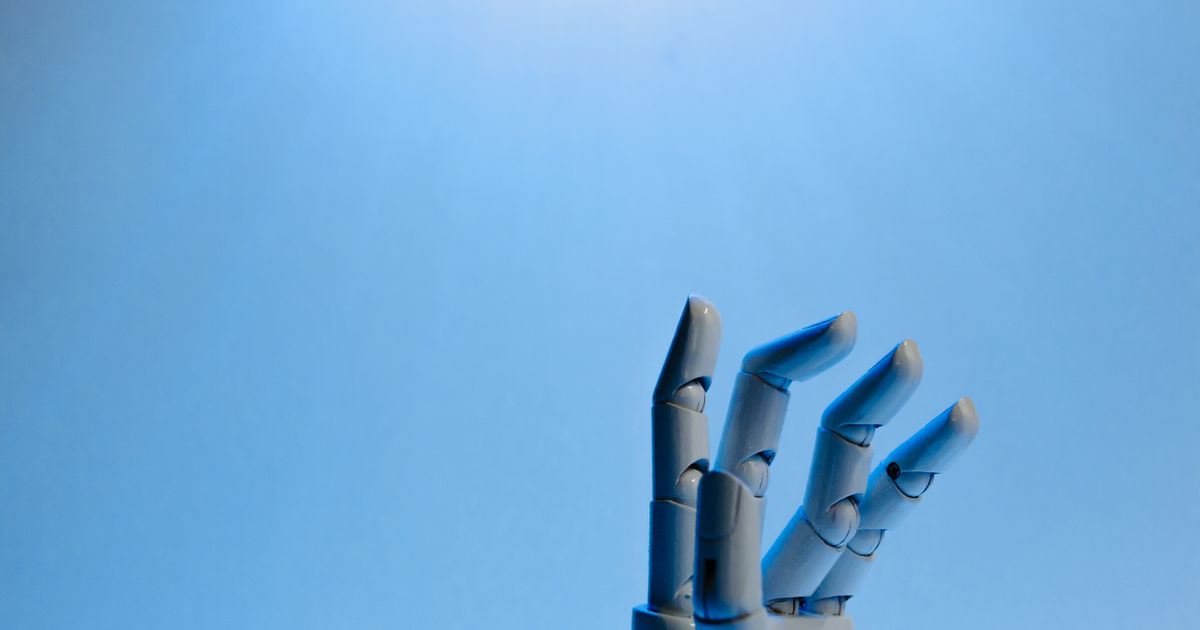 Robotic hand with articulated fingers on a blue background